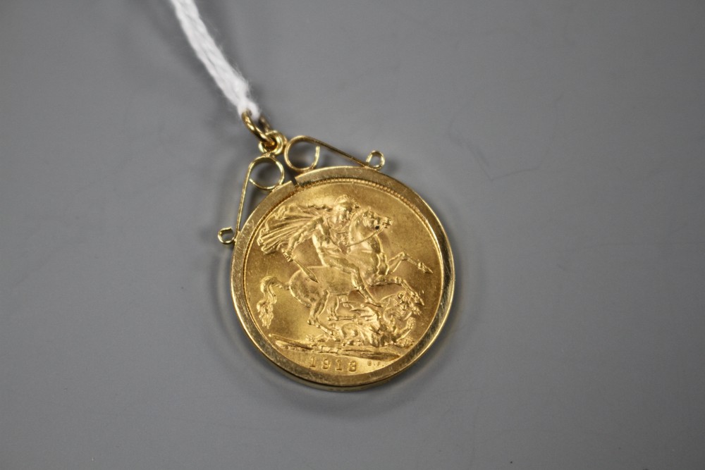 A George V 1913 gold full sovereign, in later 9ct gold pendant mount, gross weight 9.4 grams.